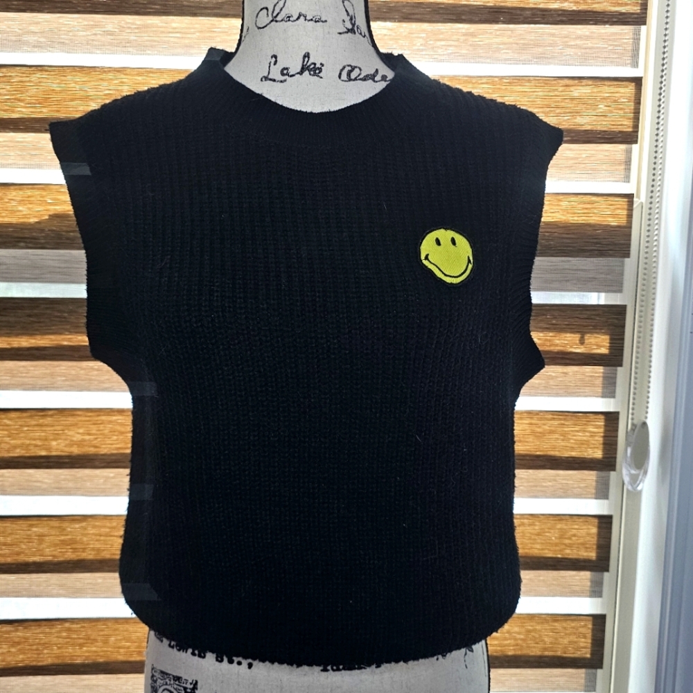 sweater vest w/ a smile on it